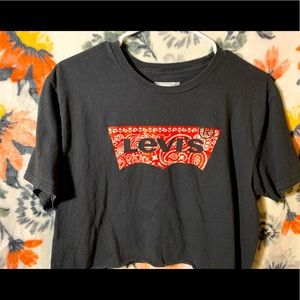 A cropped black Levi shirt